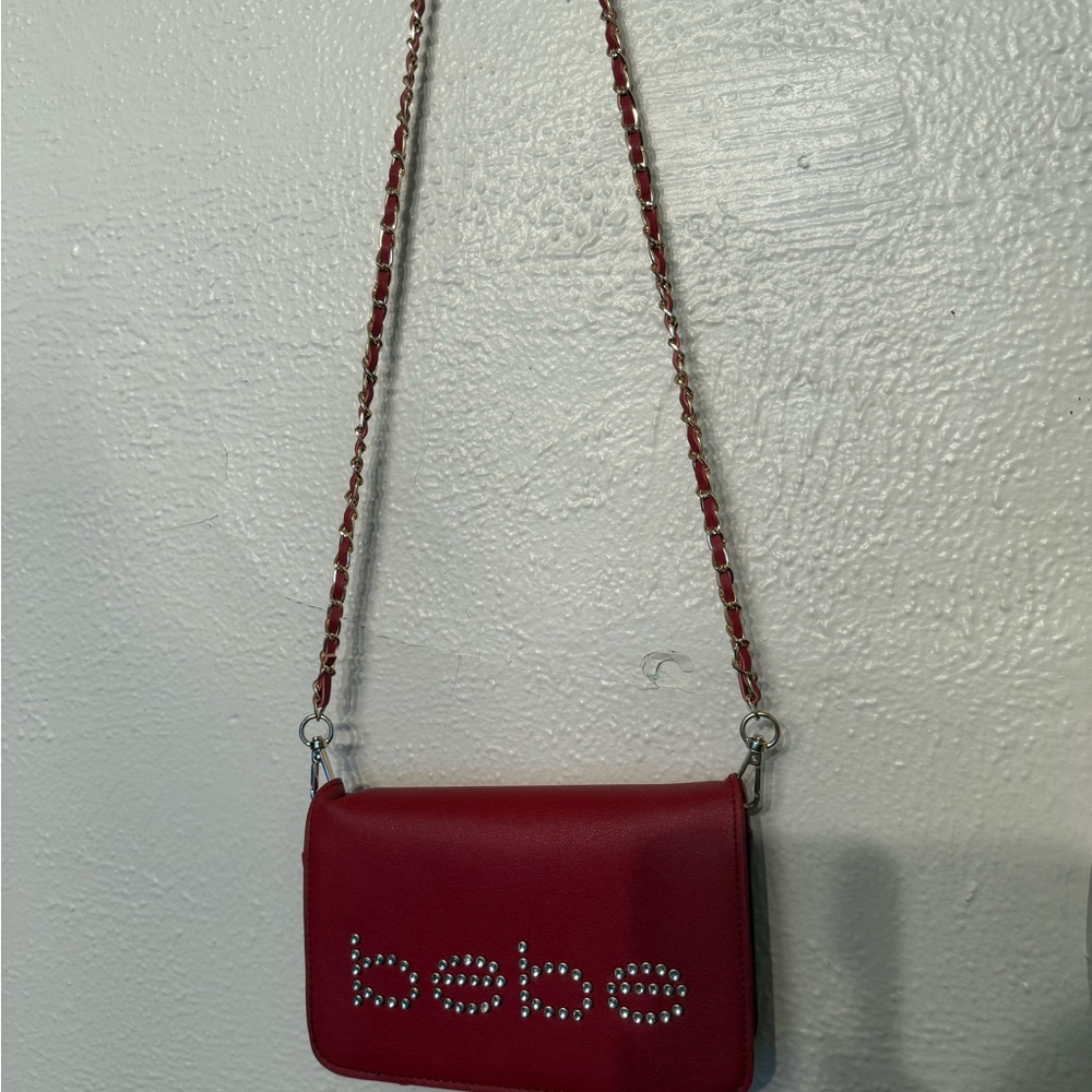 Bebe Red Crossbody Bag with Sleek Design and Silver Hardware